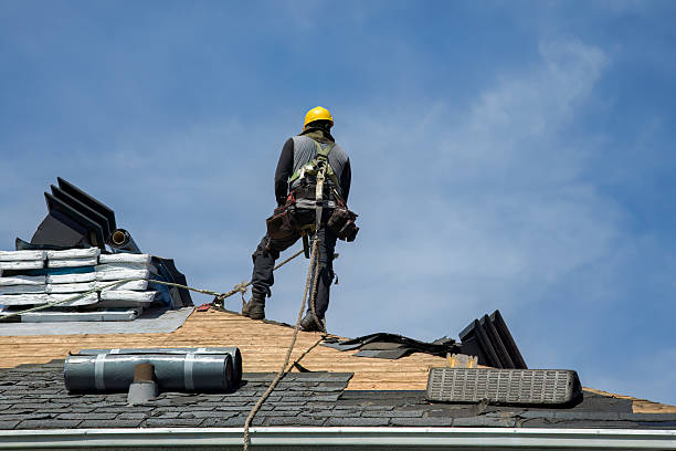 Professional Roofing technician working in Hume, MO